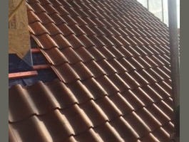 An image of a newly tiled roof we did