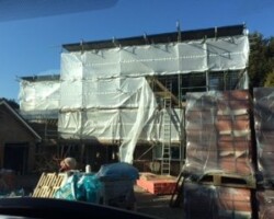 An Image of a house that is being renovated using scaffolding