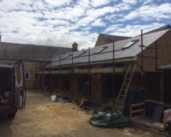 An Image of a house that is being renovated using scaffolding